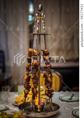 meat on skewers, camping with the cooking meat meat on skewers, camping with the cooking meat 39177452