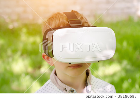 Boy in a virtual reality helmet Boy in a virtual reality helmet 39180685