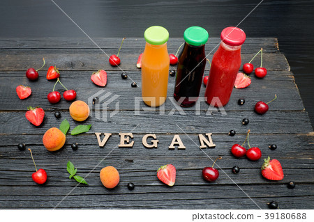 Three bottles with juice, fruit 39180688