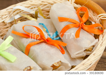 Bars of muesli in a package on a basket. Close up Bars of muesli in a package on a basket. Close up 39180690