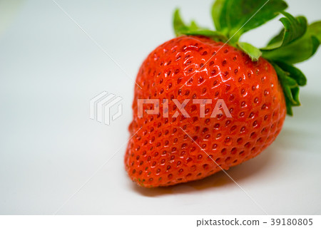Close-up photo of a fully ripened strawberry: its vibrant red flesh and seeds. Close-up photo of a fully ripened strawberry: its vibrant red flesh and seeds. 39180805