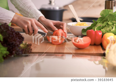 Close Up of human hands cooking vegetable salad in Close Up of human hands cooking vegetable salad in 39183645
