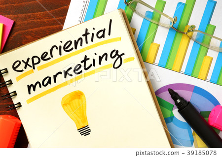 Notepad with experiential marketing on the table. Notepad with experiential marketing on the table. 39185078