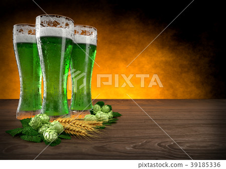three glasses of green beer with barley and hops 39185336