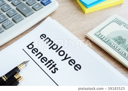 Document with title employee benefits on a desk. Document with title employee benefits on a desk. 39185525