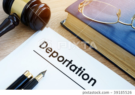 Deportation and other documents on a desk. 39185526