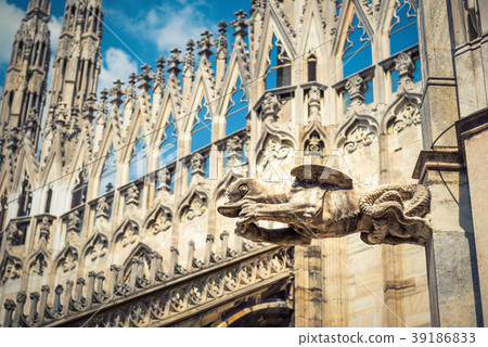 Gargoyle on the roof of Milan Cathedral 39186833