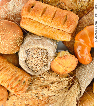 Background of bread made from wheat and rye flour. Background of bread made from wheat and rye flour. 39186896