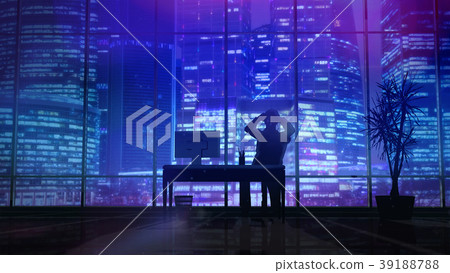 Silhouette of a man working late in the office at 39188788