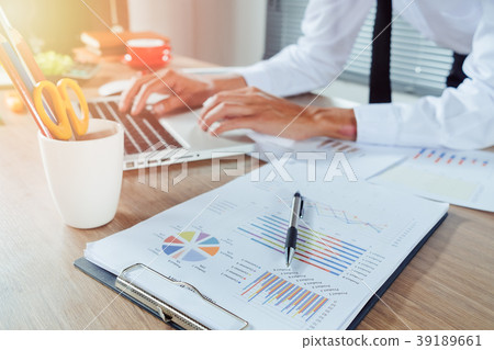 Businessman hand working with financial data Businessman hand working with financial data 39189661