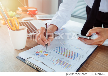 Businessman hand working with business graph Businessman hand working with business graph 39189662