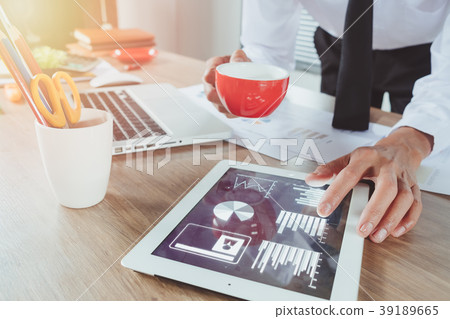 Business man working with digital tablet Business man working with digital tablet 39189665