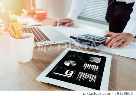 Businessman hand working with financial data Businessman hand working with financial data 39189668