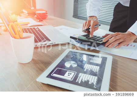 Businessman hand working with financial about cost Businessman hand working with financial about cost 39189669