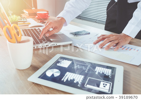 Businessman analyzing investment chart Businessman analyzing investment chart 39189670