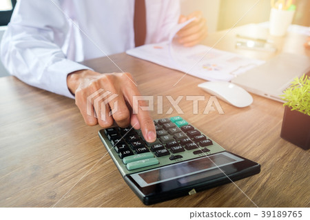 Businessman hand working with financial data Businessman hand working with financial data 39189765