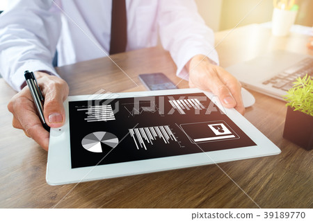 Business man working with digital tablet Business man working with digital tablet 39189770