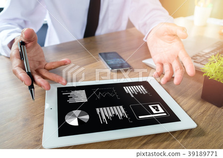 Business man working with digital tablet Business man working with digital tablet 39189771