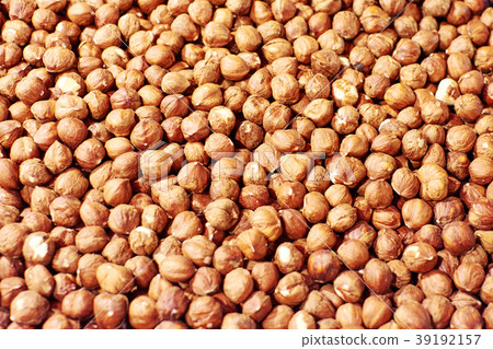 Hazelnut Background. Heap of peeled hazelnuts. Hazelnut Background. Heap of peeled hazelnuts. 39192157