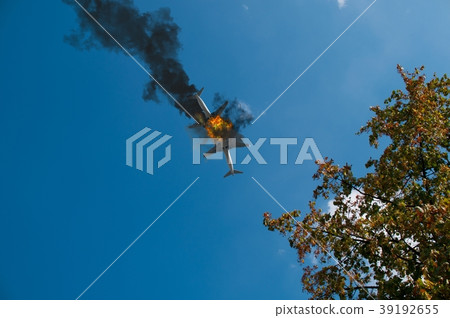 Airplane collision at the sky, explosion visible 39192655
