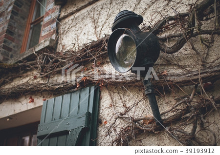 Old wall lantern in a rustic style Old wall lantern in a rustic style 39193912