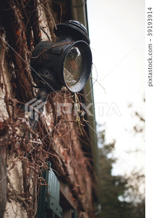 Old wall lantern in a rustic style Old wall lantern in a rustic style 39193914