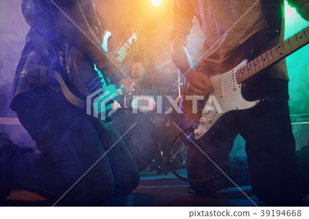 The musician plays an acoustic guitar. Scene 39194668