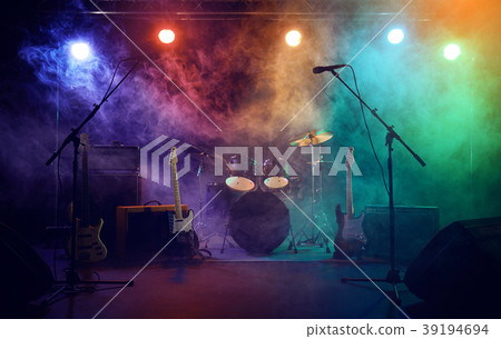 The musician plays an acoustic guitar. Scene 39194694