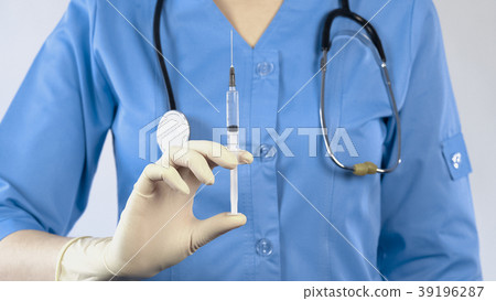 Doctor with antibiotic syringe preparing for Doctor with antibiotic syringe preparing for 39196287