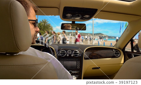 Rich man in sunglasses waiting for green light Rich man in sunglasses waiting for green light 39197123