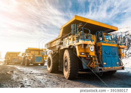 Large quarry dump truck. Loading the rock in Large quarry dump truck. Loading the rock in 39198017