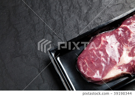 Raw steak in an airtight packaging Raw steak in an airtight packaging 39198344