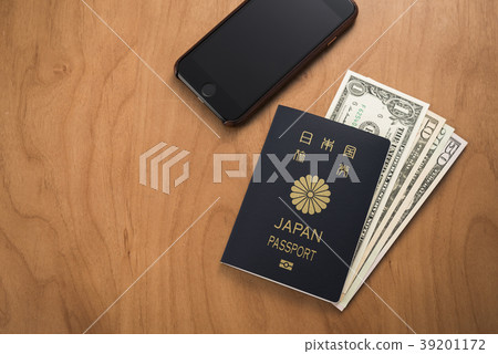 Passport and dollar bills and smartphones Passport and dollar bills and smartphones 39201172