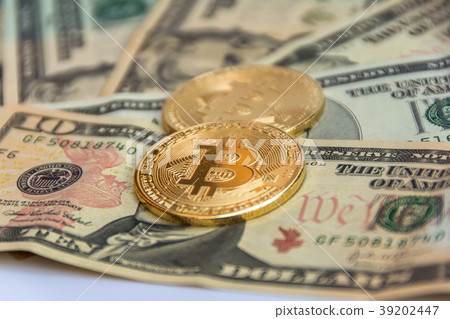 golden bitcoin coin on us dollars .Digital Money golden bitcoin coin on us dollars .Digital Money 39202447