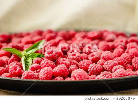Fresh sweet raspberry and green basil, summer food Fresh sweet raspberry and green basil, summer food 39203079