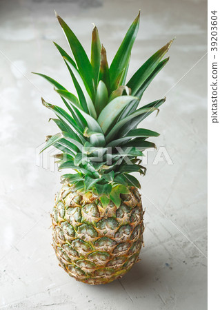 Whole pineapple fruit on grey concrete background 39203604