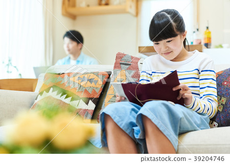 Girl reading a book Girl reading a book 39204746