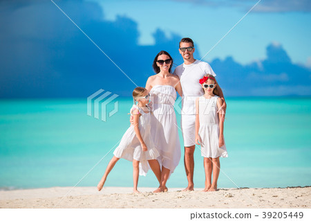 Happy beautiful family on the beach Happy beautiful family on the beach 39205449
