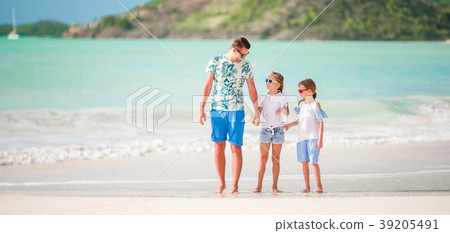 Young father and her adorable little daughters on 39205491
