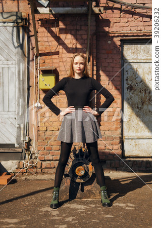 Pretty model posing on old factory backyard 39206232