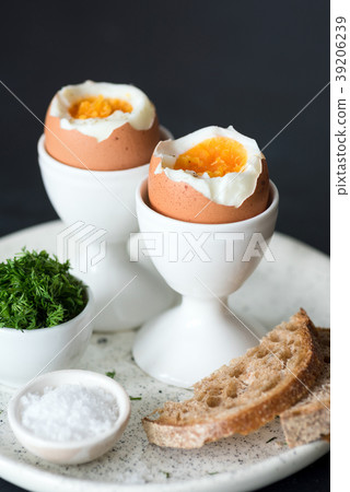 Boiled eggs with sea salt and toasted bread for 39206239