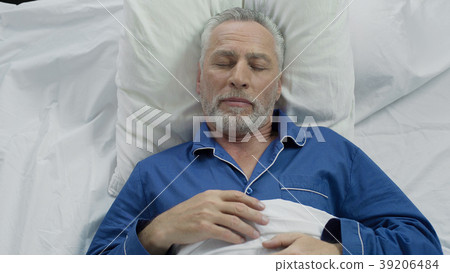 Old man enjoying sleeping comfort due to Old man enjoying sleeping comfort due to 39206484