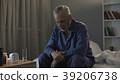 Depressed senior person sitting in bed and 39206738