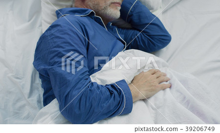 Old man sleeping in bed in the morning, recovery 39206749