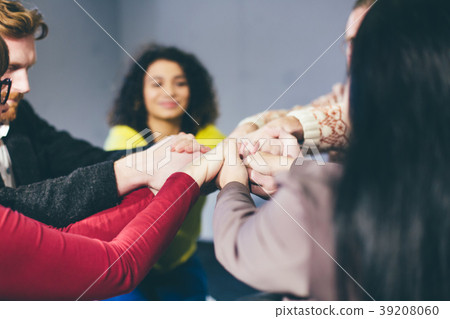 Group therapy session sitting in a circle 39208060