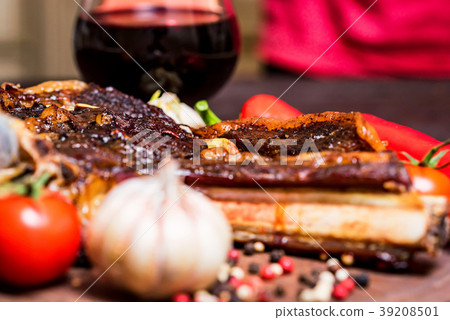 Beef steak with spices, vegetables and wine close 39208501