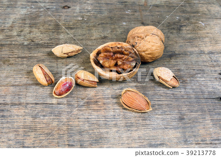 Mixed nut on rustic wood background Mixed nut on rustic wood background 39213778