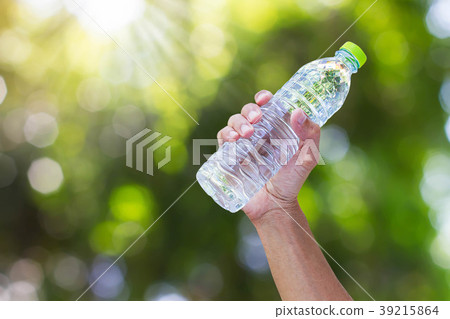 Hand holding drinking water bottle Hand holding drinking water bottle 39215864