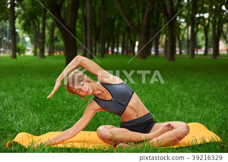 girl engaged in fitness and gymnastics in the park girl engaged in fitness and gymnastics in the park 39216329
