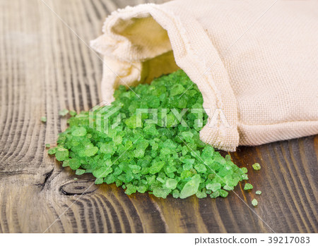 green bath salt in bag on wooden surface green bath salt in bag on wooden surface 39217083